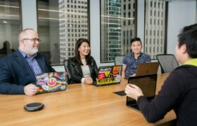 people in a design meeting in an office boardroom